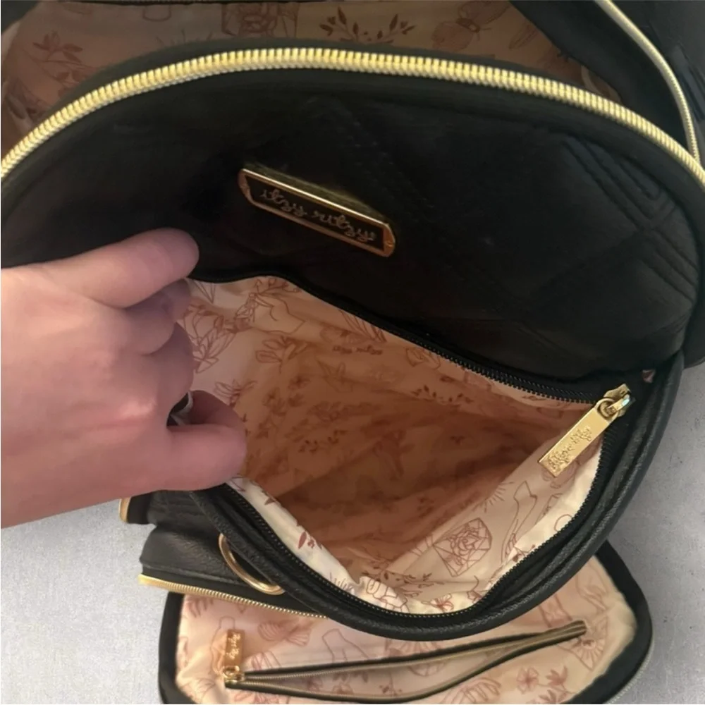 Itzy Ritzy Boss Plus black diaper bag backpack with gold hardware.